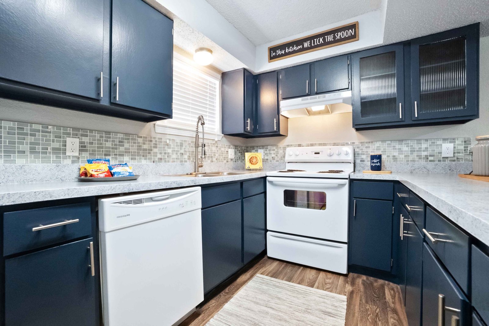 The Preserve at Turtle Creek — Kitchen with navy cabinetry